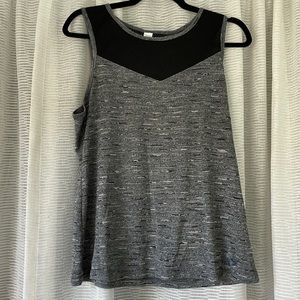 Black and gray workout tank with mesh detail and keyhole back